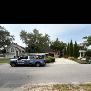 south tampa gutter and window cleaning truck parked in driveway with equipment visible and homes in the background